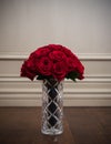 Closeup of red roses flower bouquet in crystal vase Royalty Free Stock Photo