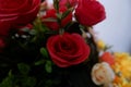 Close up of red roses fake flowers composition macro, flowers decoration ornamental background, made from fabric and plastic Royalty Free Stock Photo