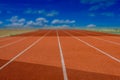 Red Running track with corner of the football field. Royalty Free Stock Photo