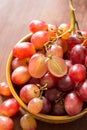 Close up red seedless grapes in a ceramic bowl Royalty Free Stock Photo