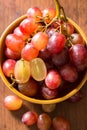 Close up red seedless grapes in a ceramic bowl on Royalty Free Stock Photo