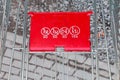 Close up of red shopping cart outside supermarket Royalty Free Stock Photo