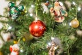 Close up of a red sparkly Christmas ball decoration on a Christmas tree Royalty Free Stock Photo