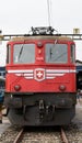 Close-up of a red Swiss train being boarded