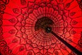 Close up of a red traditional burmese umbrella view from inside, asian background