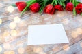 Close up of red tulips and blank paper or letter Royalty Free Stock Photo