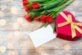 Close up of red tulips, letter and chocolate box Royalty Free Stock Photo