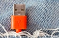 Close-up the red USB cable in jeans pocket Royalty Free Stock Photo