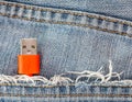 Close-up the red USB cable in jeans pocket Royalty Free Stock Photo