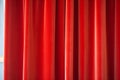 a close-up of red velvet stage curtains