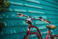 Close-up red vintage bicycle parking on blue wooden wall with copy space Royalty Free Stock Photo