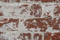 Close-up of red vintage cracked brick wall with white plaster, texture, background Royalty Free Stock Photo