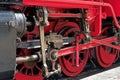 Close-up of red wheels of an old steam train locomotive Royalty Free Stock Photo