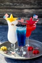 Close up of red, white and blue cocktails on a tray to celebrate 4th of July.