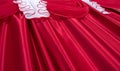 Close up of red and white color lambrequin and curtains, silk texture with folds Royalty Free Stock Photo