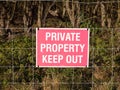 Close up of red and white country sign private property keep out Royalty Free Stock Photo