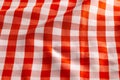 Close up of red and white wrinkly vichy fabric