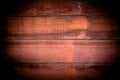 Close-up of Red wood panels used as background, red wood surface. vintage tone with vignetting Royalty Free Stock Photo