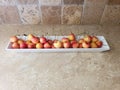 Close up on red and yellow cherries on a white plate