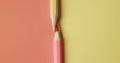 Close up of red and yellow pencil crayons on red and yellow background with copy space Royalty Free Stock Photo