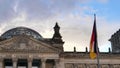 Reichstag dome and german national flag at berlin in germany Royalty Free Stock Photo