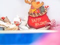 Close up of a reindeer christmas ornament wishing happy holidays. Royalty Free Stock Photo