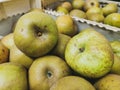 Close up of reinette grise du canada apples in wooden crates. Prepared for sale. Wooden box