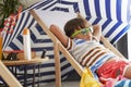 Close up of relaxed boy lying on a chair at home Royalty Free Stock Photo