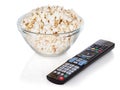 Close-up of remote control and bowl of popcorn Royalty Free Stock Photo