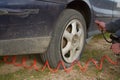 Close up of repair of a flat tire with tire inflation with a compressed air compressor where the tire visibly swells