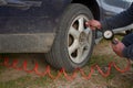 Close up of repair of a flat tire with tire inflation with a compressed air compressor where the tire visibly swells