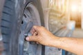 Close up of repair mechanic hands during maintenance work to loosen a wheel nut changing tyre of car Royalty Free Stock Photo