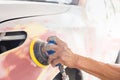 Close up of A repairman sanding with a grinder and prepares the paint for the car, Car repair concept