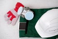 Close-up of respirator, gloves, green work clothes, phone in pocket, hardhat, concept of special protective professional shoes, Royalty Free Stock Photo