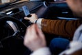 Putting smartphone away for safe drive on the road stock photo