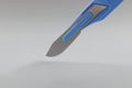 Retractable pocket sized box cutter, sharp colour knife for cutting things Royalty Free Stock Photo