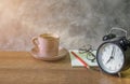 Close-up of retro alarm black clock vintage style with Blank open book, red pencil and glasses cup coffee pastel pink old Royalty Free Stock Photo