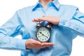 Close-up of a retro alarm clock in the hands of a businesswoman