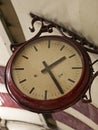 Close-up of Retro Clock Hanging from the Ceiling. Royalty Free Stock Photo