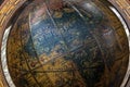 Close up of Retro World Globe in Wooden Mounting Royalty Free Stock Photo