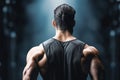 Close up reveals the muscular back of a strong, fit man