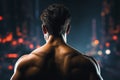 Close up reveals the muscular back of a strong, fit man