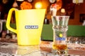 Close up on a Ricard jug and a water bottle with its logo. Ricard is a pastis, an anise and licorice flavored aperitif