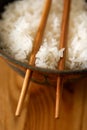 Close up of rice in a bowl with chopsticks