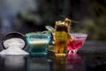 Close up of rice flour face pack on wooden surface in a blue colored glass bowl with some raw rose water,rice flour and Castor oil Royalty Free Stock Photo