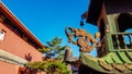 Hohhot - A close up on the richly decorated rooftop of a Chinese-style temple in Hohhot, Inner Mongolia. There is a golden dragon Royalty Free Stock Photo