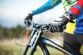 Close-up of a rider`s hand in gloves on a mountain bike handlebars Royalty Free Stock Photo