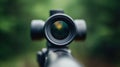 Close-up of a Rifle Scope in a Forest Setting Royalty Free Stock Photo