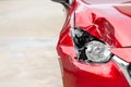 Right front of red modern car got damaged by accident. Copy space for text or advertising of insurance or car repair concept