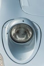 Light blue folding headlights of an old german car Royalty Free Stock Photo